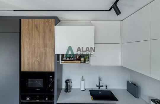 Современная угловая кухня с барной стойкой 